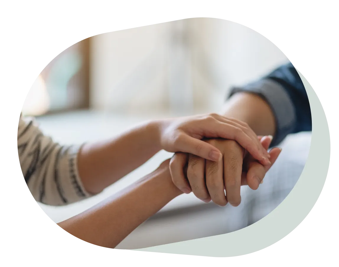 A man and a woman holding each other hands