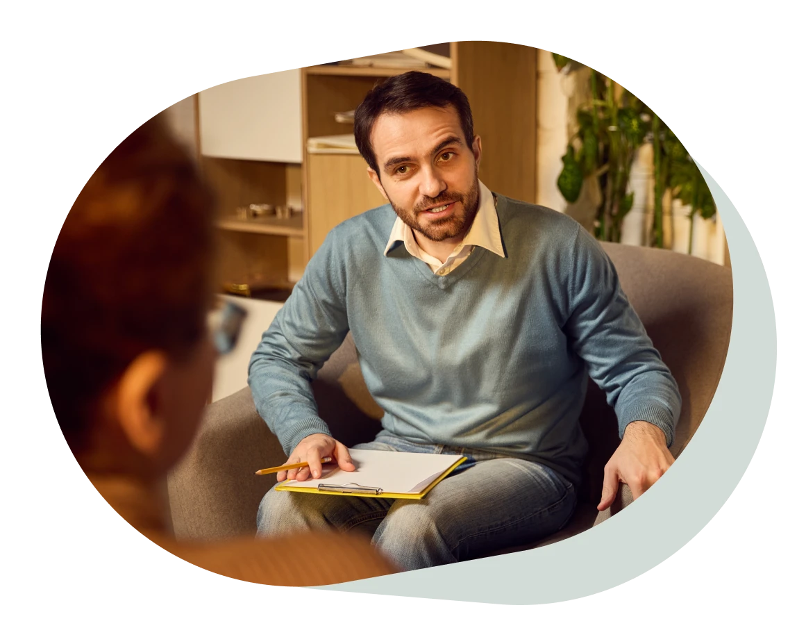 psychologist engaged in productive discussion with teenage boy
